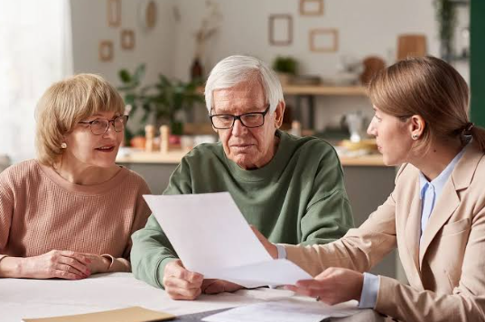 old couple having conversation to attorney