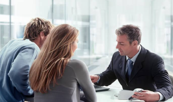 a lawyer having conversation to a couple